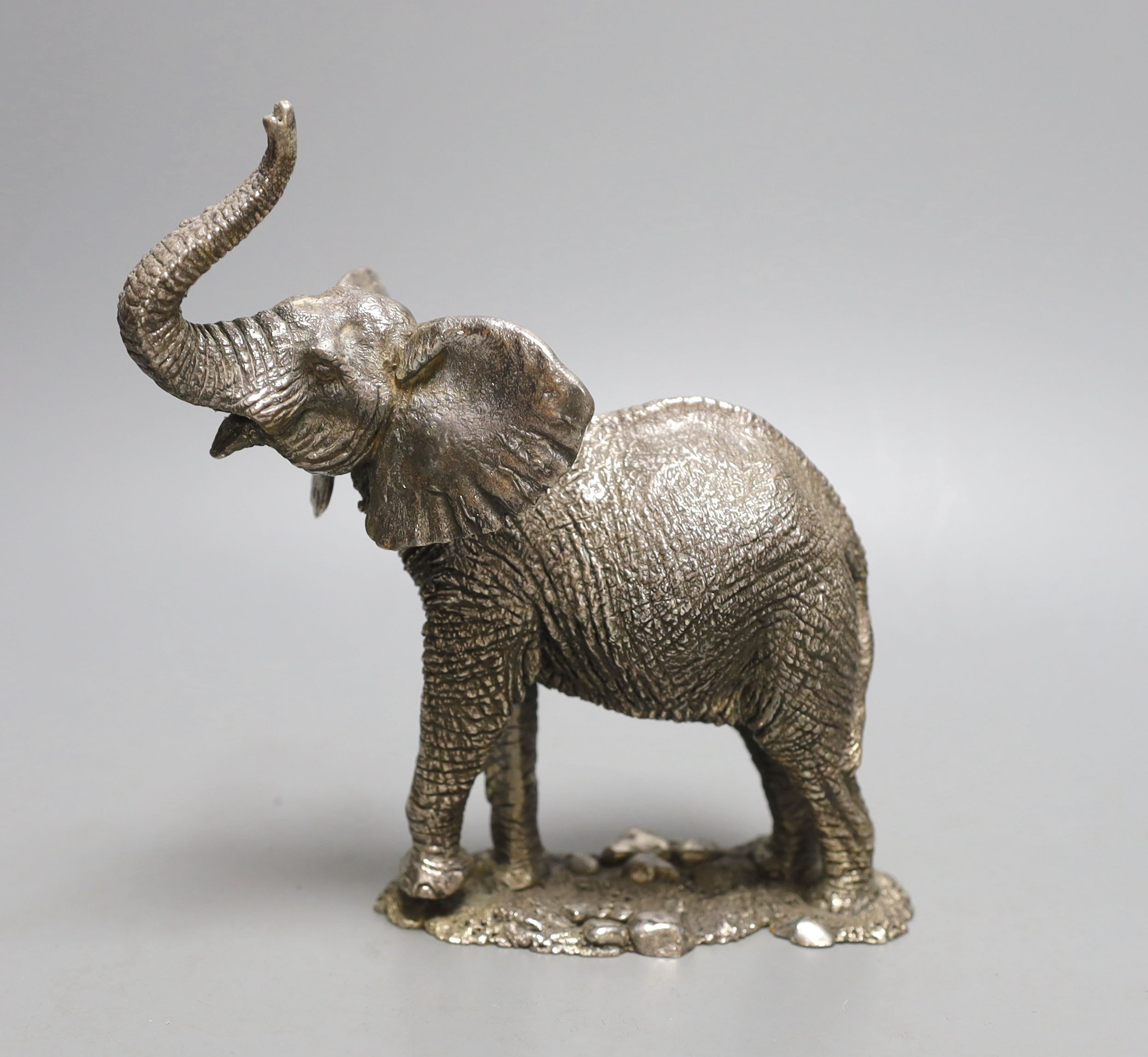 A modern miniature silver model of an elephant, maker CA, (filled), height 19cm.